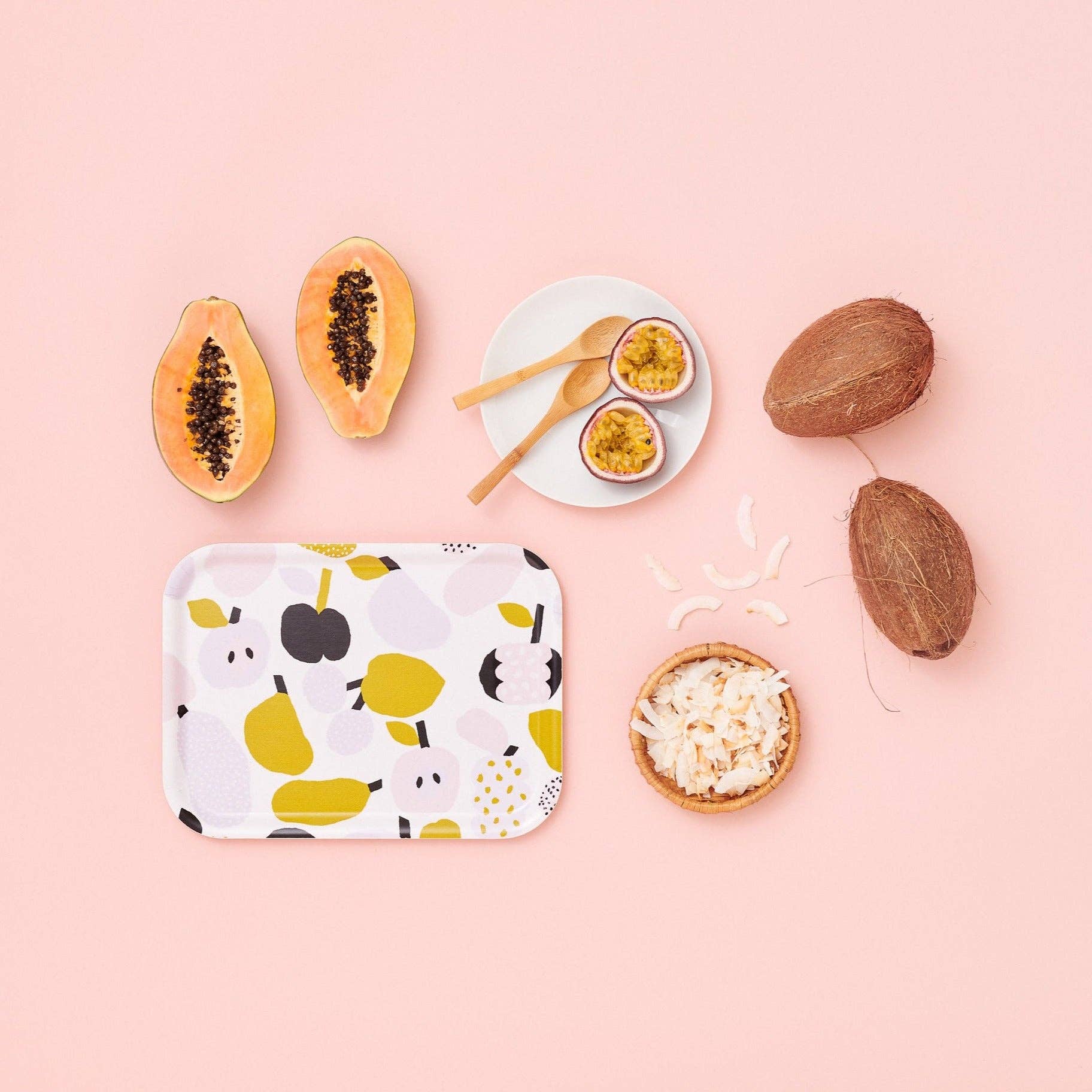 Olive green fruit-pattern birch veneer tray by Hannele Äijälä, 10.6" x 7.9" with coconuts, papayas, and a bowl of rice on a pink background.