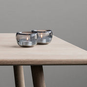 Stelton Ora Tealight Holders, set of 2 in translucent smoke glass with soft organic curves, modern Nordic design.