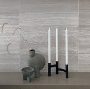 Stelton Ora Three-Branch Candleholder in black with organic sculptural design, holds three candles.
