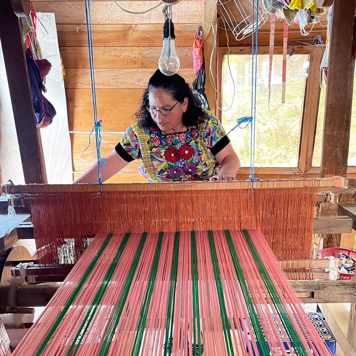 America Zipper Bag by A World of Craft in handwoven multicolored cotton stripes with nylon lining, Fair Trade handmade in Guatemala—large enough for toiletries or to use as a clutch with your phone.