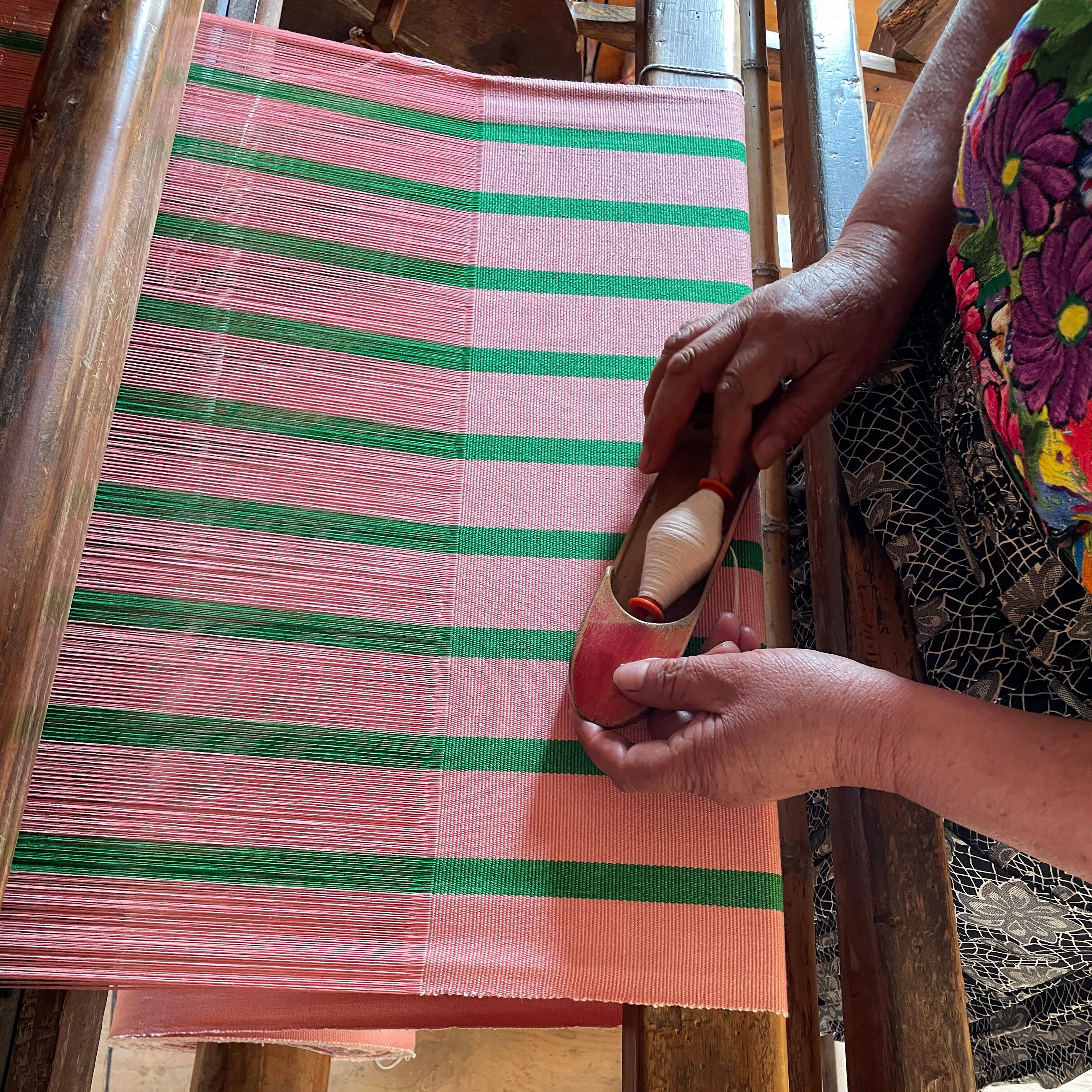 America Zipper Bag by A World of Craft in handwoven multicolored cotton stripes with nylon lining, Fair Trade handmade in Guatemala—large enough for toiletries or to use as a clutch with your phone.