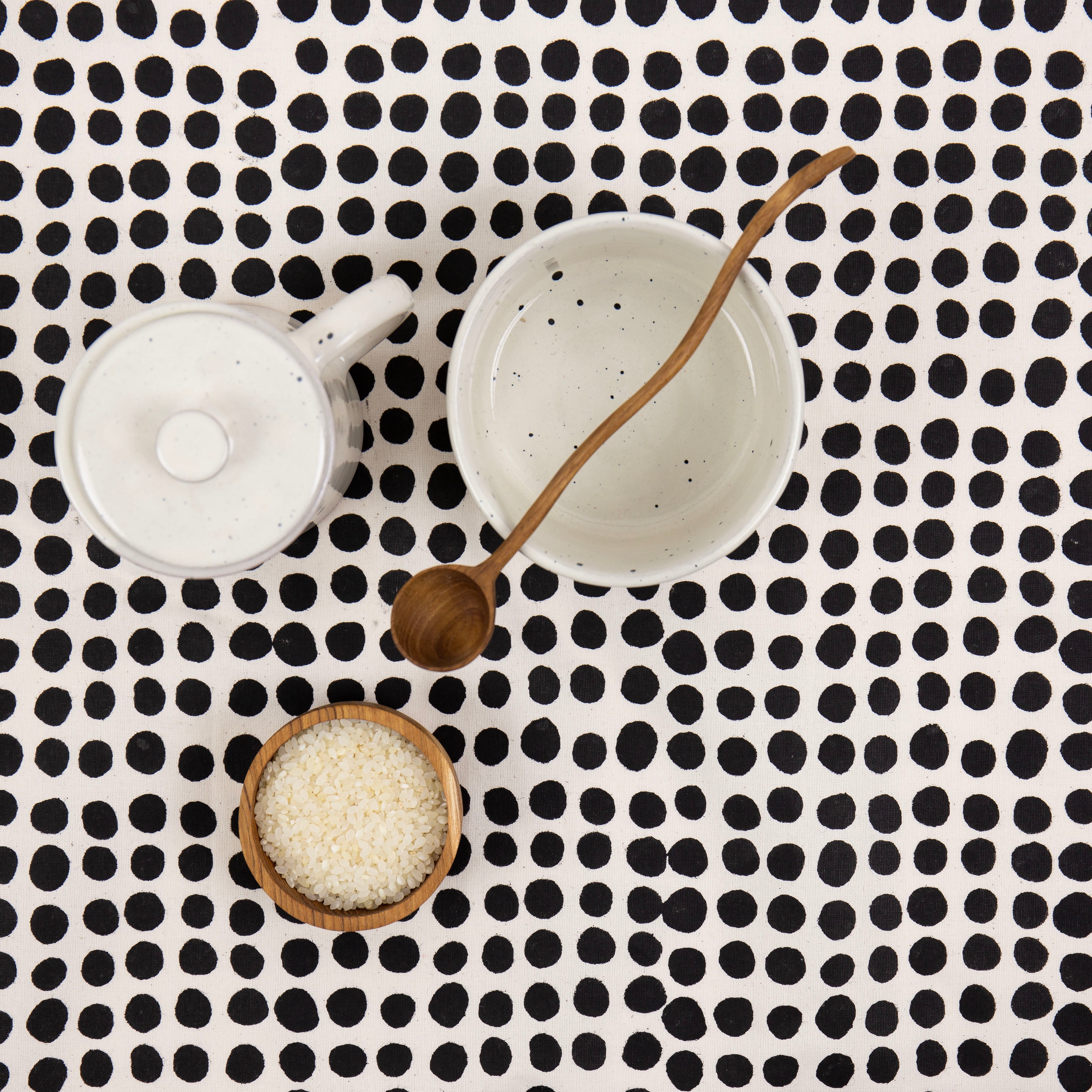 A World of Craft Dots Tablecloth, 140 × 260 cm, in white cotton with black dot print. Fair Trade, handmade in Bangladesh.