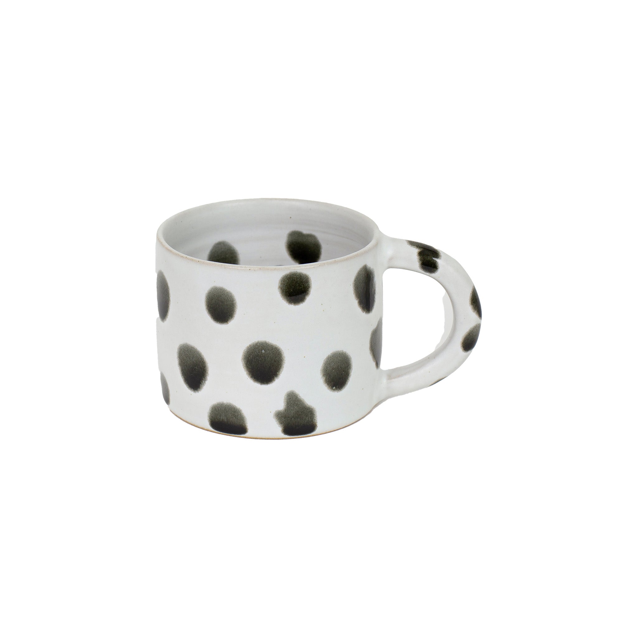 Blot Coffee Cup in matte light grey stoneware with glossy black dots. Handmade in Nepal, fair trade.