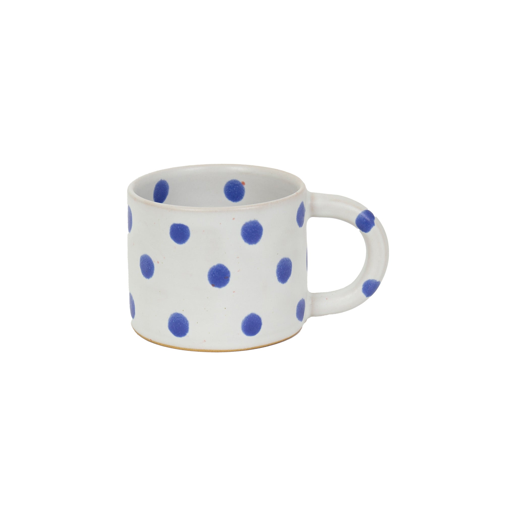 Blot Coffee Cup in matte light grey stoneware with glossy blue dots. Handmade in Nepal, fair trade.