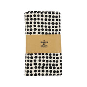 A World of Craft Dots Tablecloth, 140 × 260 cm, in white cotton with black dot print. Fair Trade, handmade in Bangladesh.