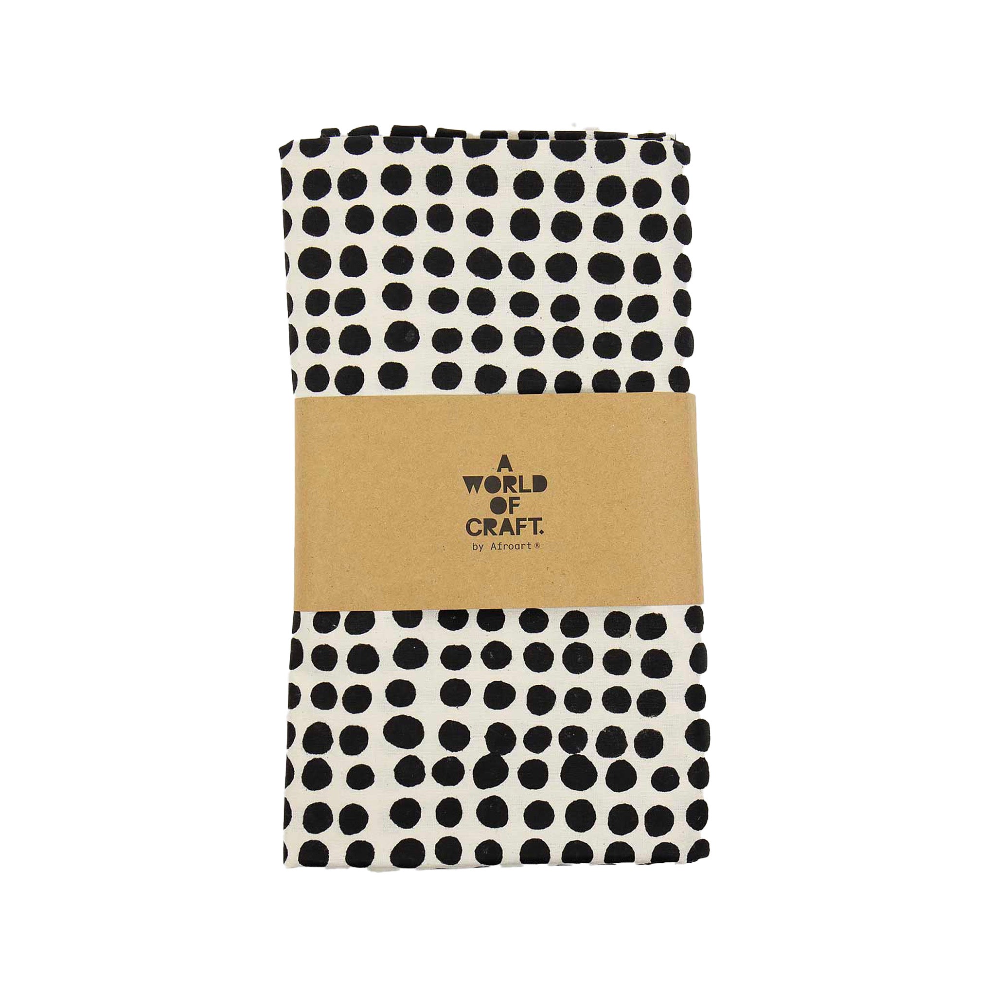 A World of Craft Dots Tablecloth, 140 × 260 cm, in white cotton with black dot print. Fair Trade, handmade in Bangladesh.