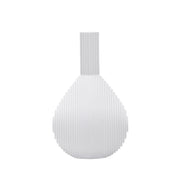Architectmade Flow Vases in white porcelain, designed by Vibeke Rytter. Inspired by water ripples and Copenhagen’s Grundtvig’s Church.