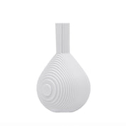 Architectmade Flow Vases in white porcelain, designed by Vibeke Rytter. Inspired by water ripples and Copenhagen’s Grundtvig’s Church.