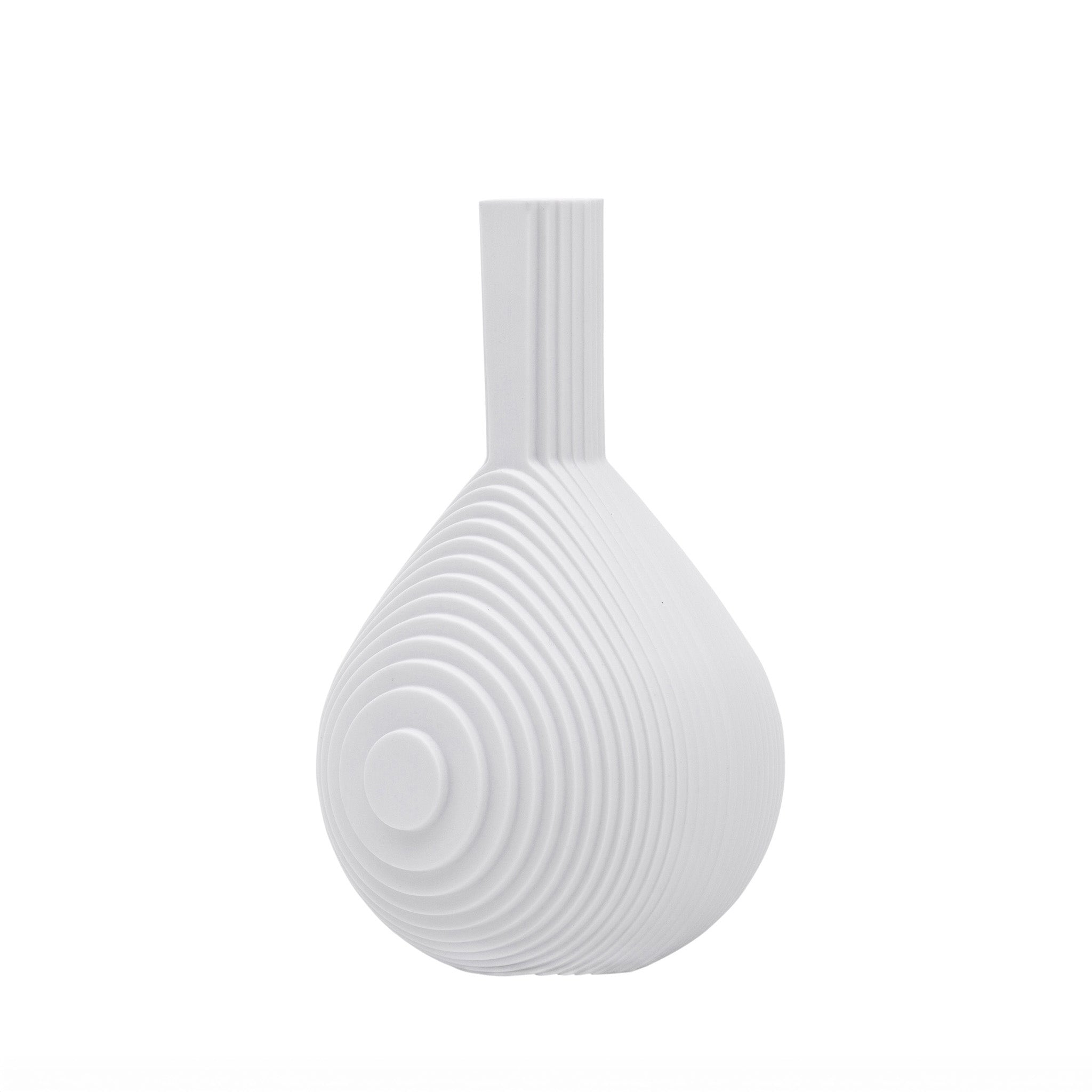 Architectmade Flow Vases in white porcelain, designed by Vibeke Rytter. Inspired by water ripples and Copenhagen’s Grundtvig’s Church.