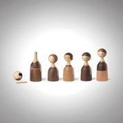 Architectmade Kin figurines by Lars Beller Fjetland, handmade in walnut, mahogany, and maple with tilting heads, shown in a mix-and-match constellation.