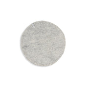 Aveva Seat Cushion in wool felt, available in raw grey or graphic patterns. Round portable chair pads in two sizes, designed in Sweden.