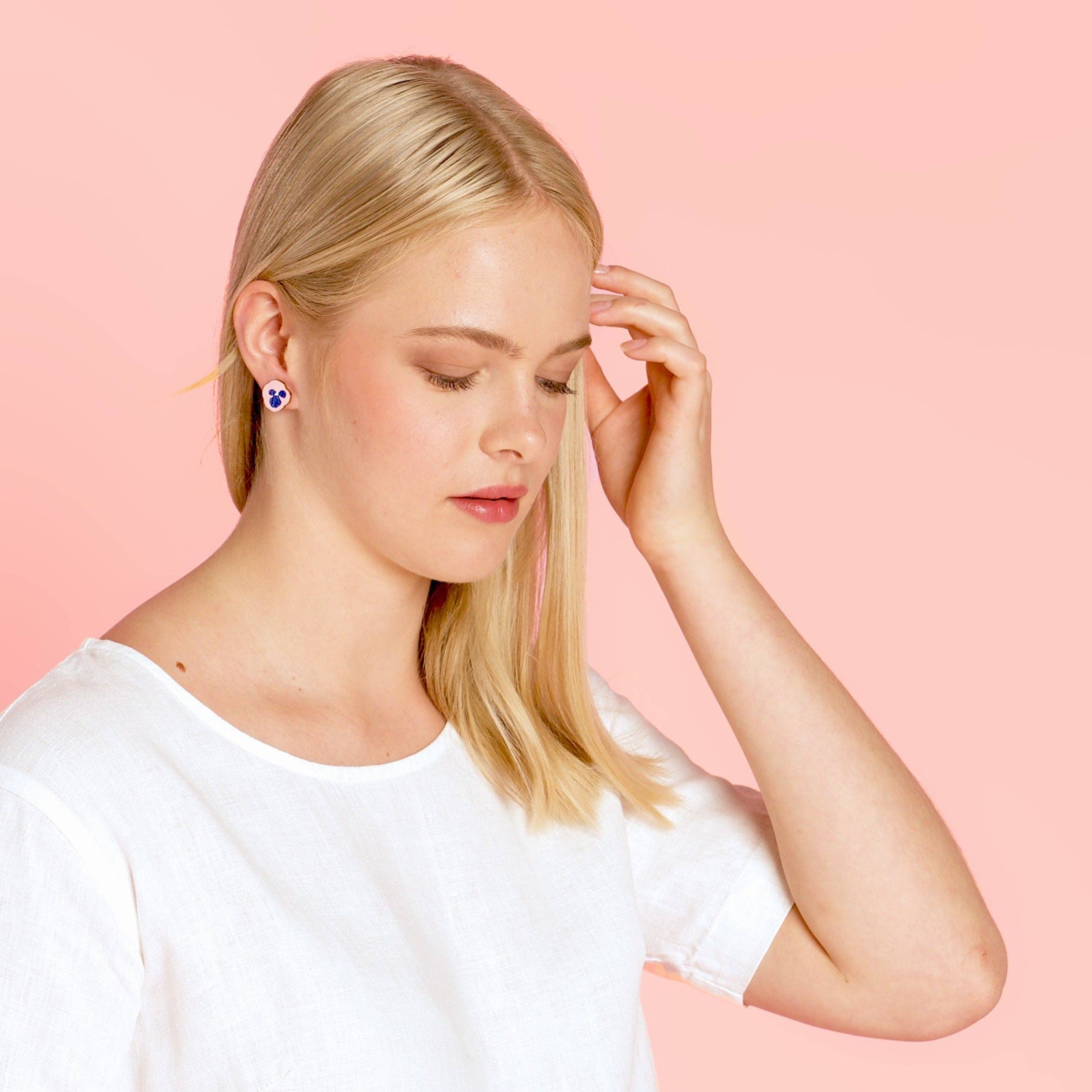 Kauniste Orvokki Earrings in yellow and pink floral birch veneer, handmade in Finland with stainless steel posts.