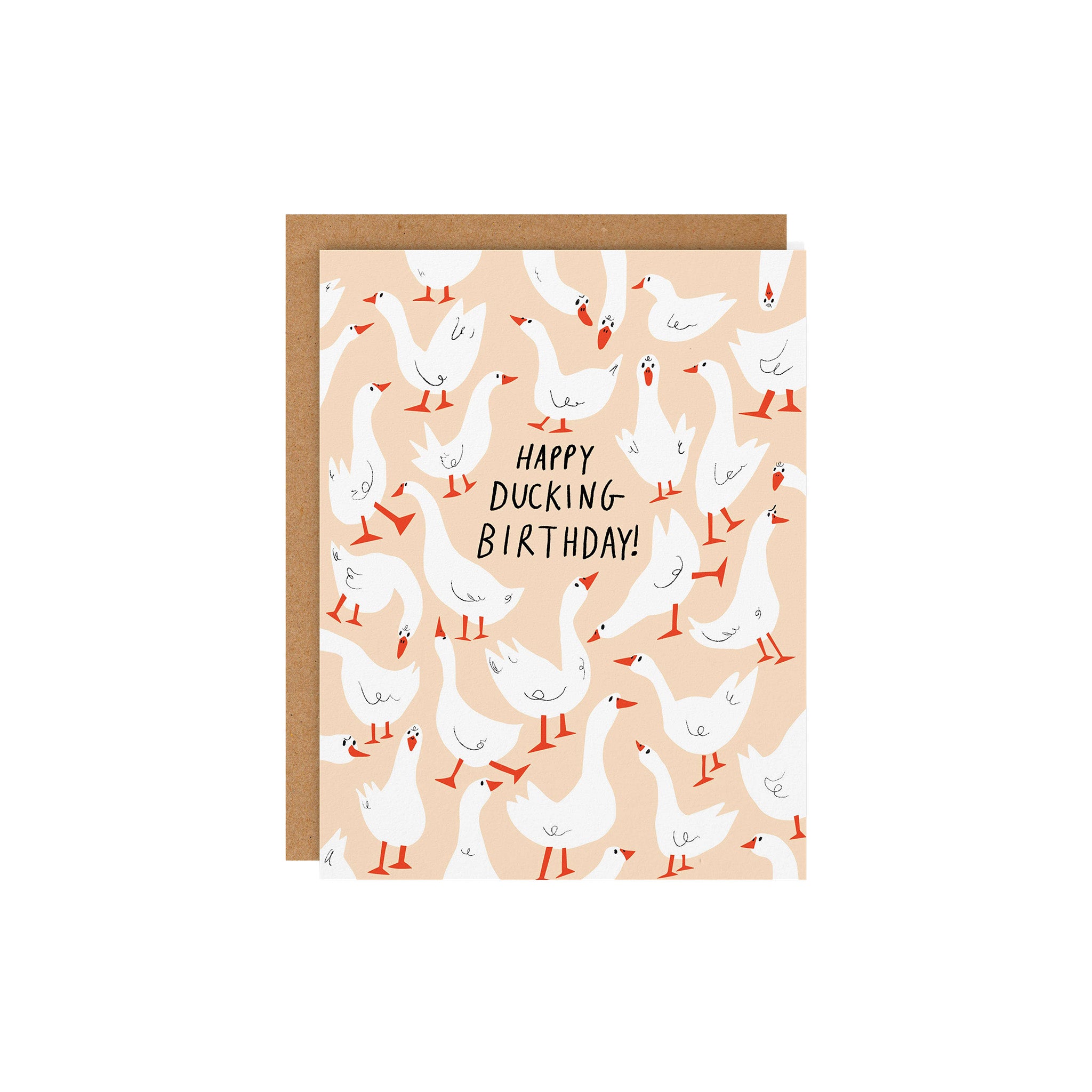 Happy Ducking Birthday Card by Badger & Burke featuring illustrated white ducks on a peach background with a kraft envelope.