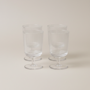 Pilastro Wine Glass Set by Stelton with four clear ribbed wine glasses featuring an Art Deco-inspired design and footed base.