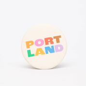 Portland Colorblock Magnet featuring bold colorful lettering spelling Portland in a modern graphic design.