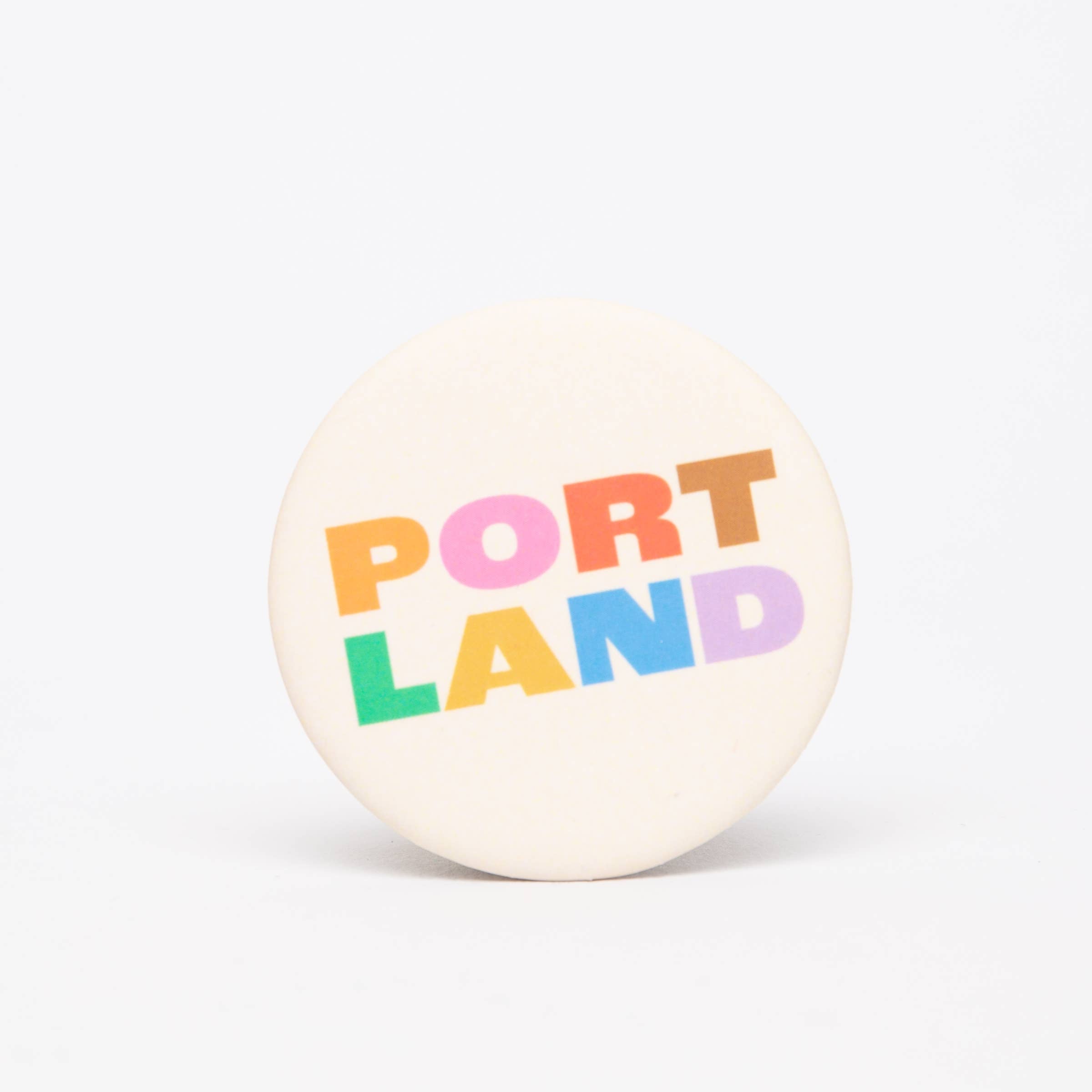 Portland Colorblock Magnet featuring bold colorful lettering spelling Portland in a modern graphic design.