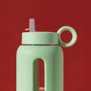 Bink Kids Bottle in borosilicate glass with silicone sleeve and flip cap. Compact, leak-proof, dishwasher safe, and kid-friendly.