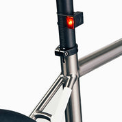 Bookman Block Bike Lights—compact, rechargeable, and easy to mount with elastic bands. Choose Front or Rear, both with 50 lumens, 4 modes, runtimes up to 31 hours, and plastic-free packaging.