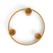 British Colour Standard Round Metal Candelabra Ring in Marigold, handmade steel design holding three taper candles at staggered heights, pictured with Saffron candles.