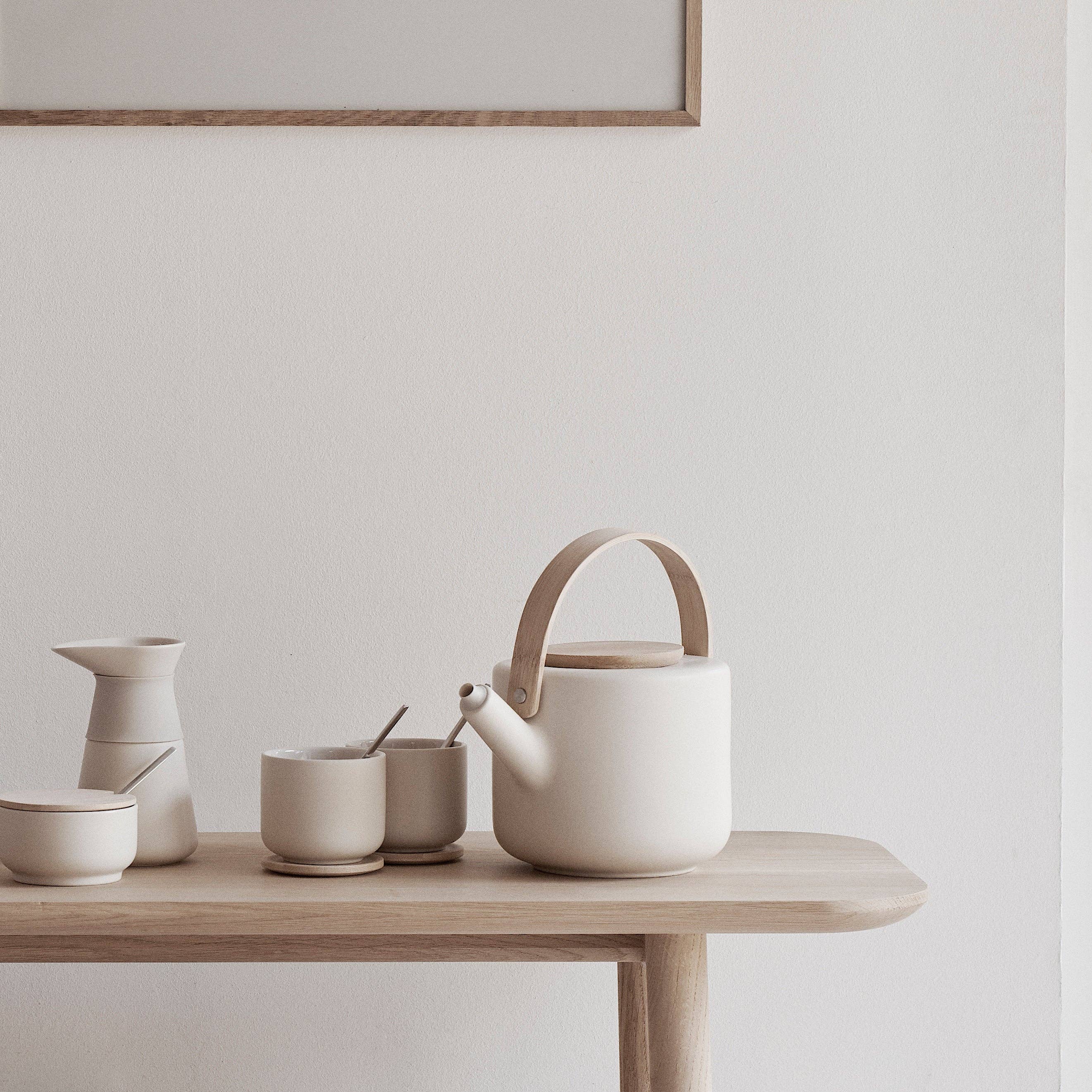 Stelton Theo Set in matte sand stoneware with glossy interior, designed by Francis Cayouette. Rustic yet modern Nordic.