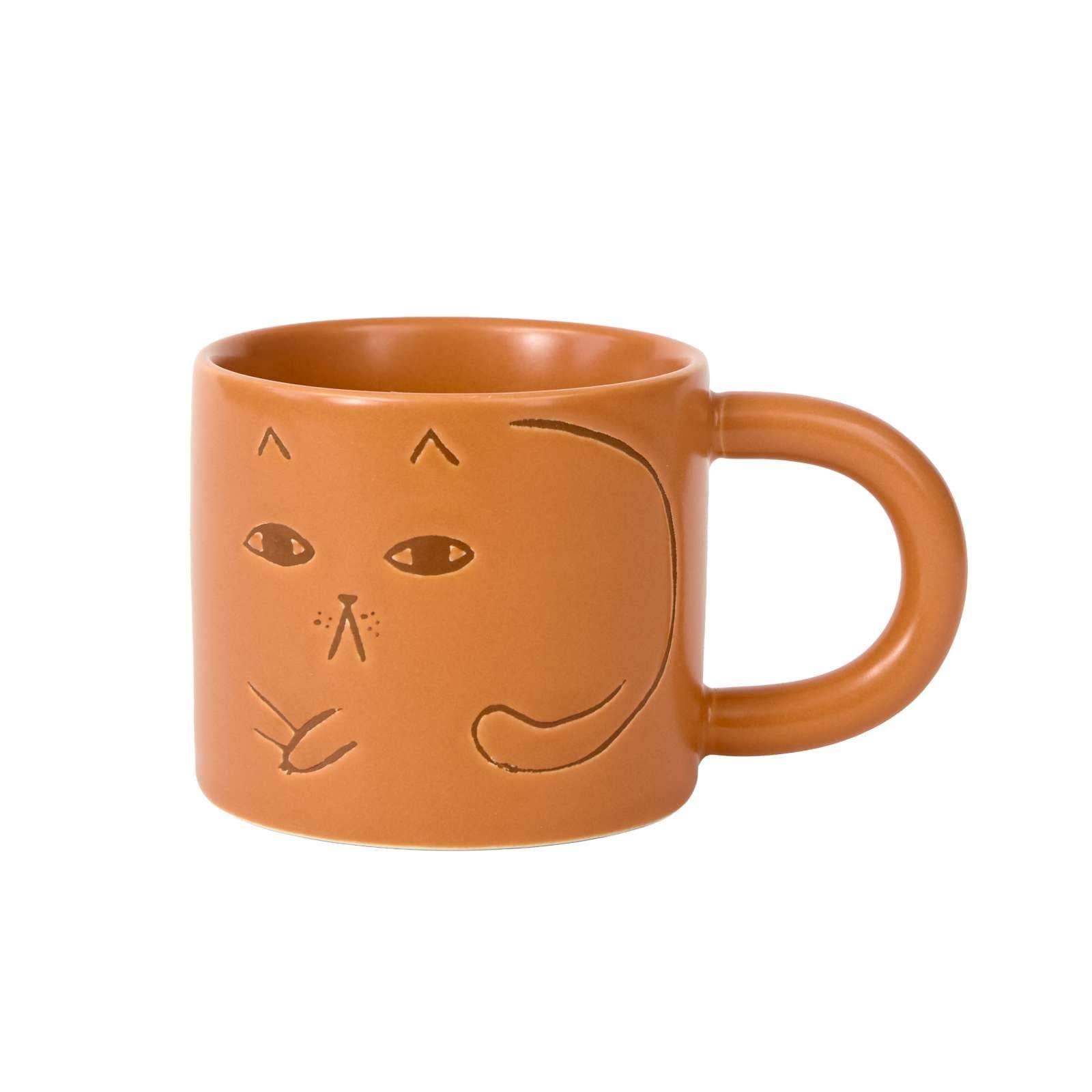 Donna Wilson Cat Mug in warm terracotta with debossed cat illustrations and chunky rounded handle.