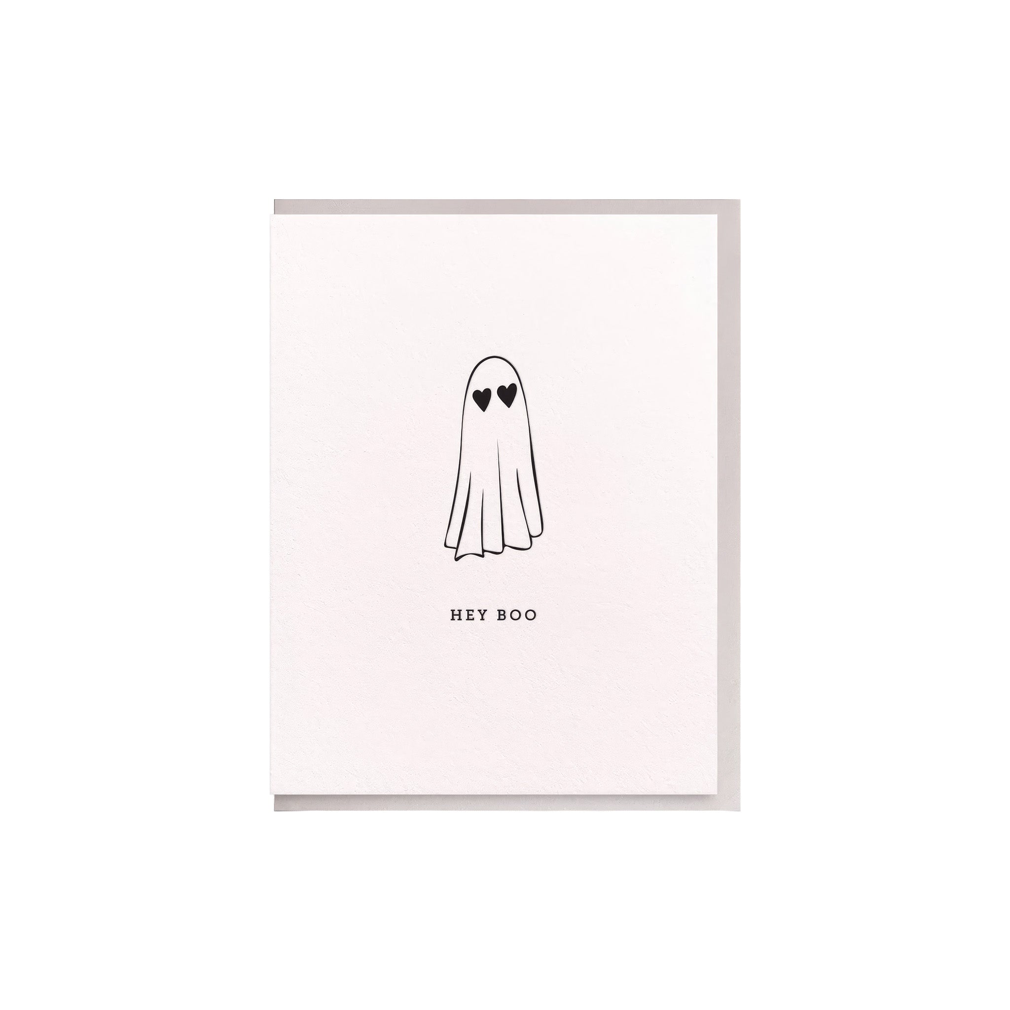 Dahlia Press Hey Boo greeting card with black line-drawn ghost, heart-shaped eyes, and Hey Boo lettering on a white background.