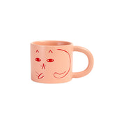 Donna Wilson candy-pink ceramic Cat Mug with debossed cat images, tactile coffee or tea mug.