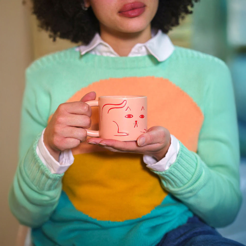 Donna Wilson candy-pink ceramic Cat Mug with debossed cat images, tactile coffee or tea mug.
