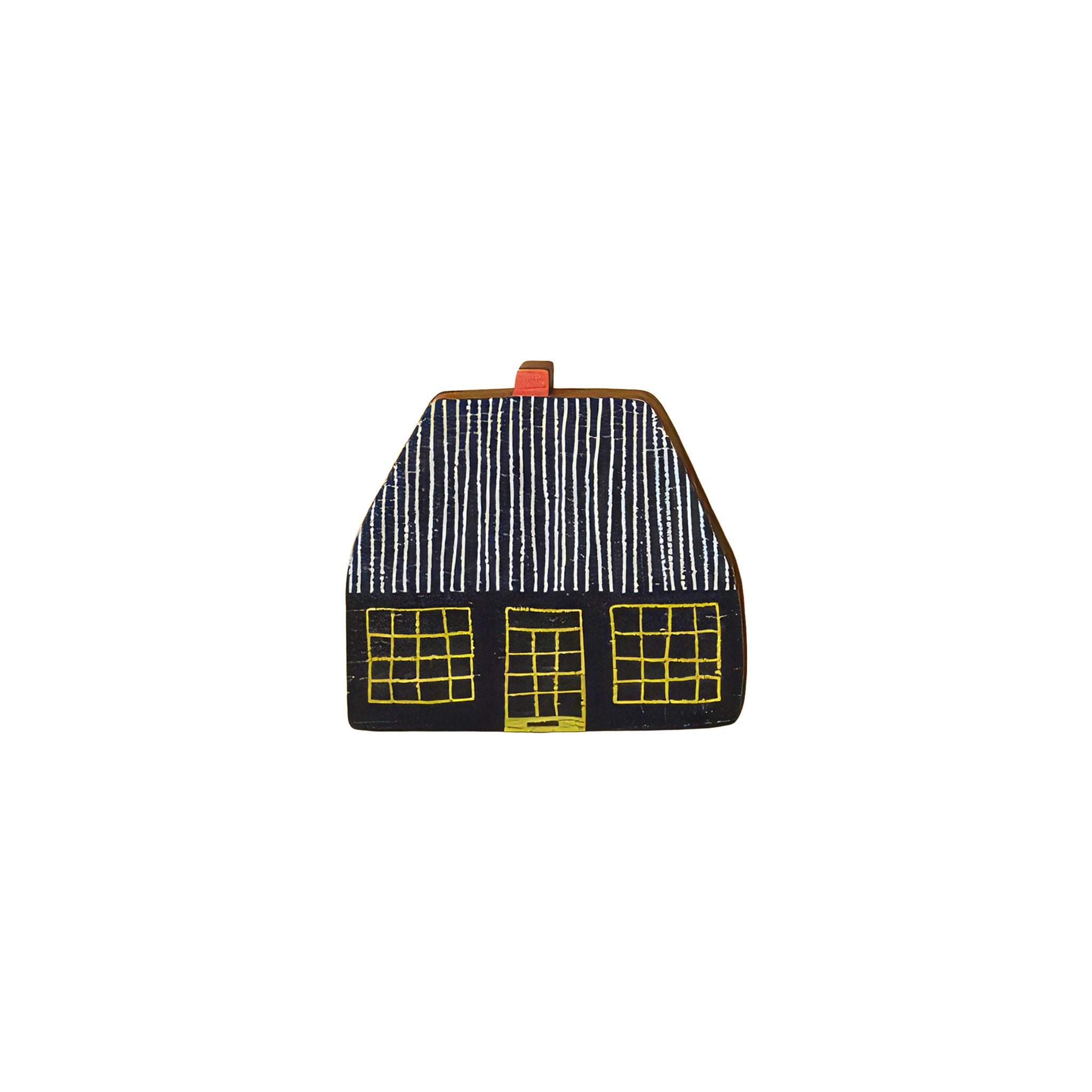 Donna Wilson Cottage Pin featuring a black cottage with a striped roof and yellow windows, made from sustainably sourced beech wood with a metal butterfly clutch backing.