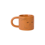Donna Wilson Cat Mug in warm terracotta with debossed cat illustrations and chunky rounded handle.