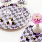 Blu Kat Checker Serving Tray in lilac and olive check pattern, available in two sizes (27 × 20 cm or 31 cm round). FSC-certified birch veneer, handcrafted in Sweden.
