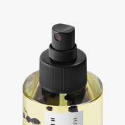 Hetkinen Elderberry Body Oil in a glass bottle with a real elder branch inside, featuring a nourishing blend of plant oils and notes of elderberry, blackcurrant, and sage.