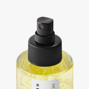Hetkinen Lichen Body Oil in a glass bottle with a real lichen element inside, featuring a fresh botanical fragrance inspired by Finnish wetlands.