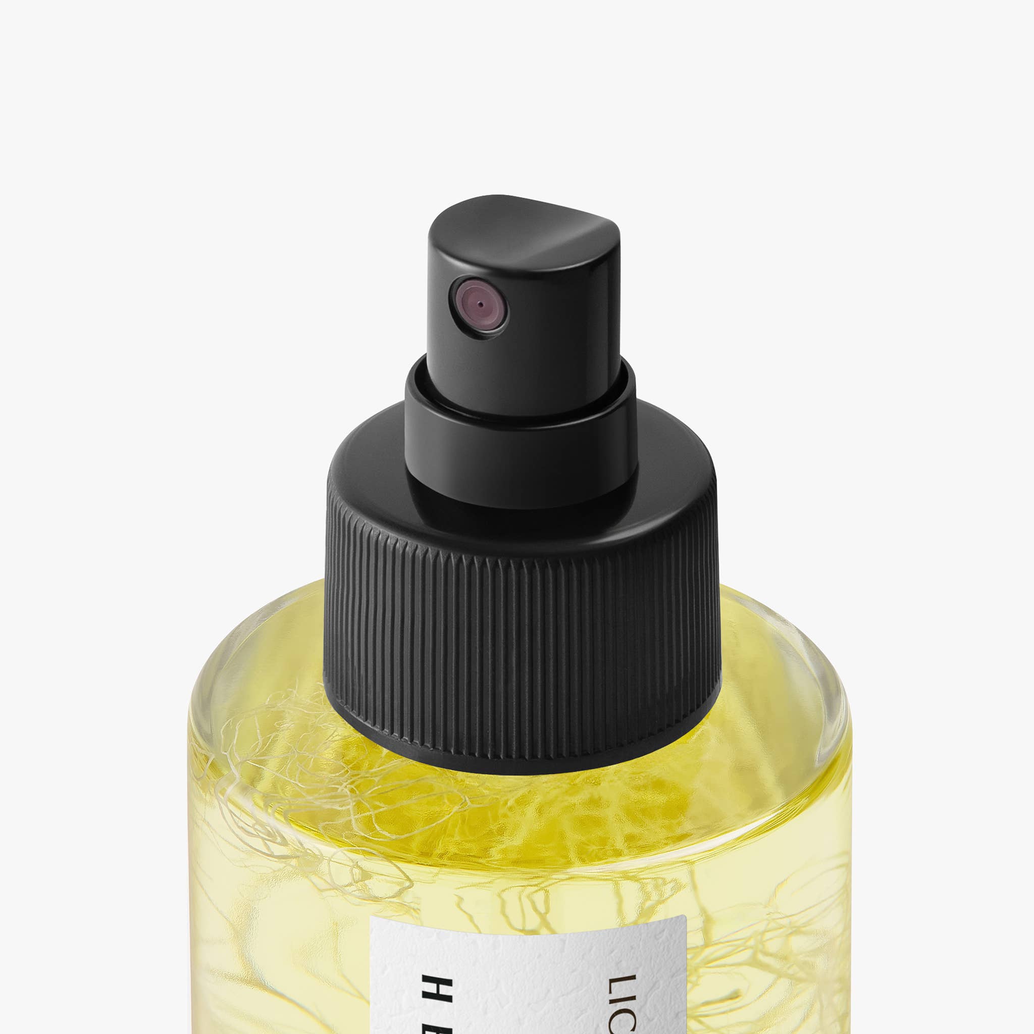 Hetkinen Lichen Body Oil in a glass bottle with a real lichen element inside, featuring a fresh botanical fragrance inspired by Finnish wetlands.
