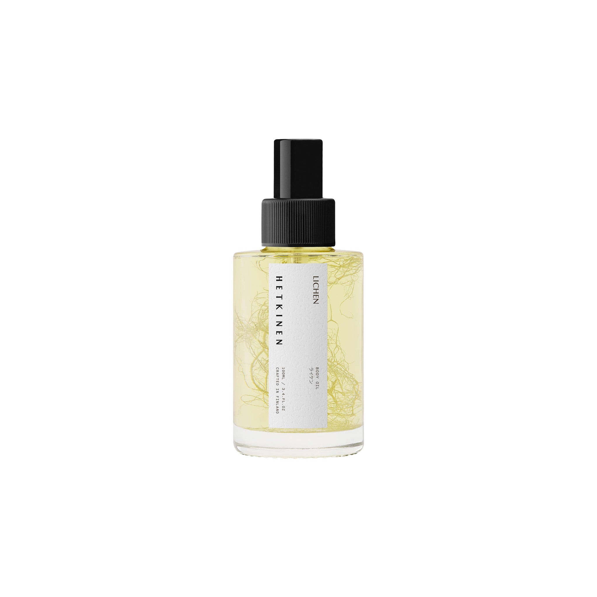 Hetkinen Lichen Body Oil in a glass bottle with a real lichen element inside, featuring a fresh botanical fragrance inspired by Finnish wetlands.