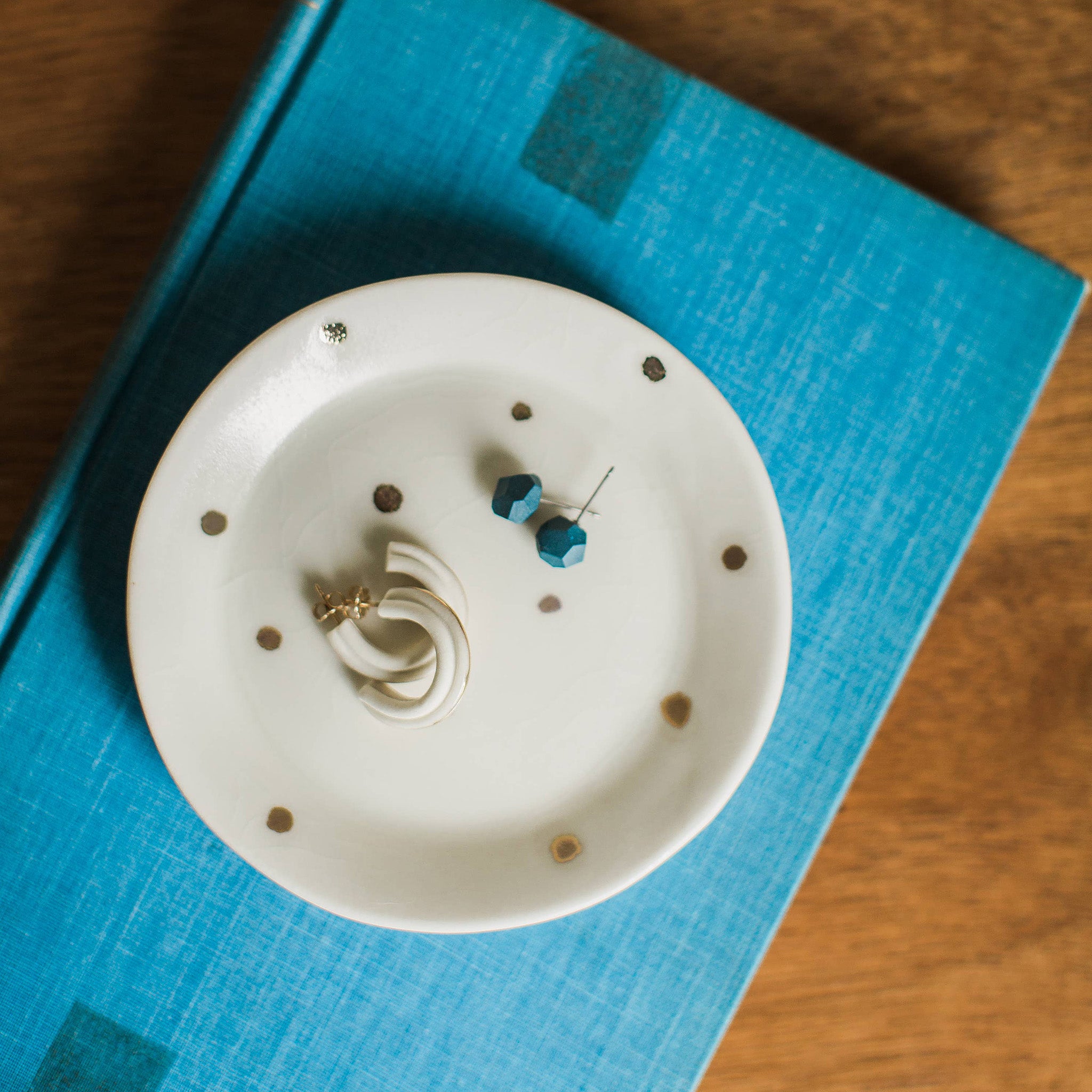 Dark teal porcelain faceted stud earrings handmade by designer Jenna Vanden Brink, minimalist everyday studs with titanium backs