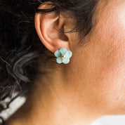 Handmade porcelain Flower Stud earrings by Jenna Vanden Brink with colorful petals and 22K gold luster centers.
