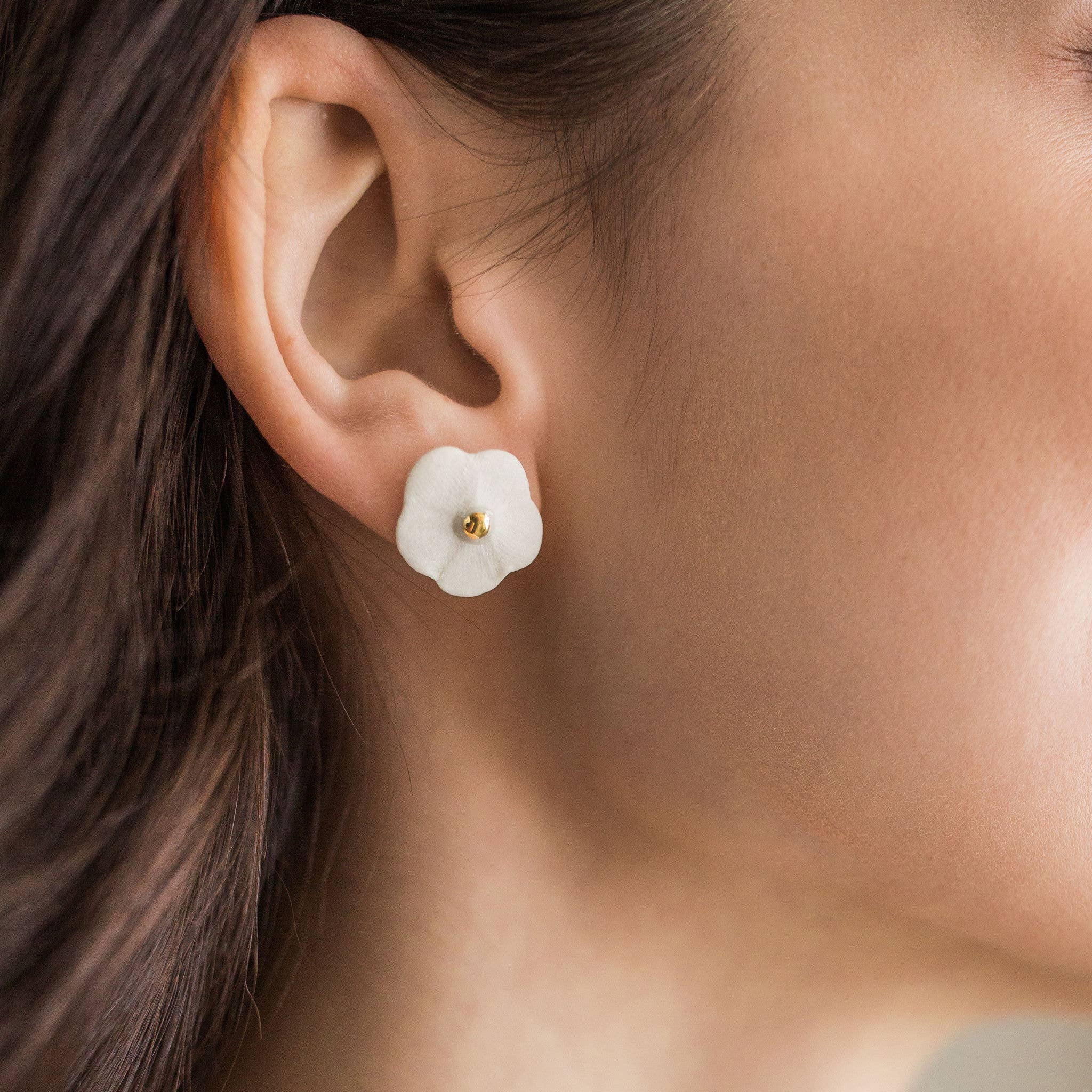 Handmade porcelain Flower Stud earrings by Jenna Vanden Brink with colorful petals and 22K gold luster centers.