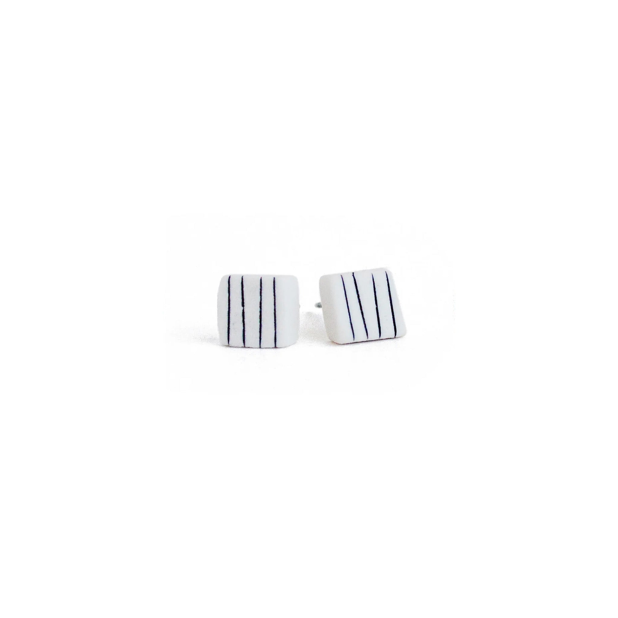 Porcelain pinstripe square stud earrings by Jenna Vanden Brink, ¼″ black & white handmade studs with hypoallergenic titanium hardware
