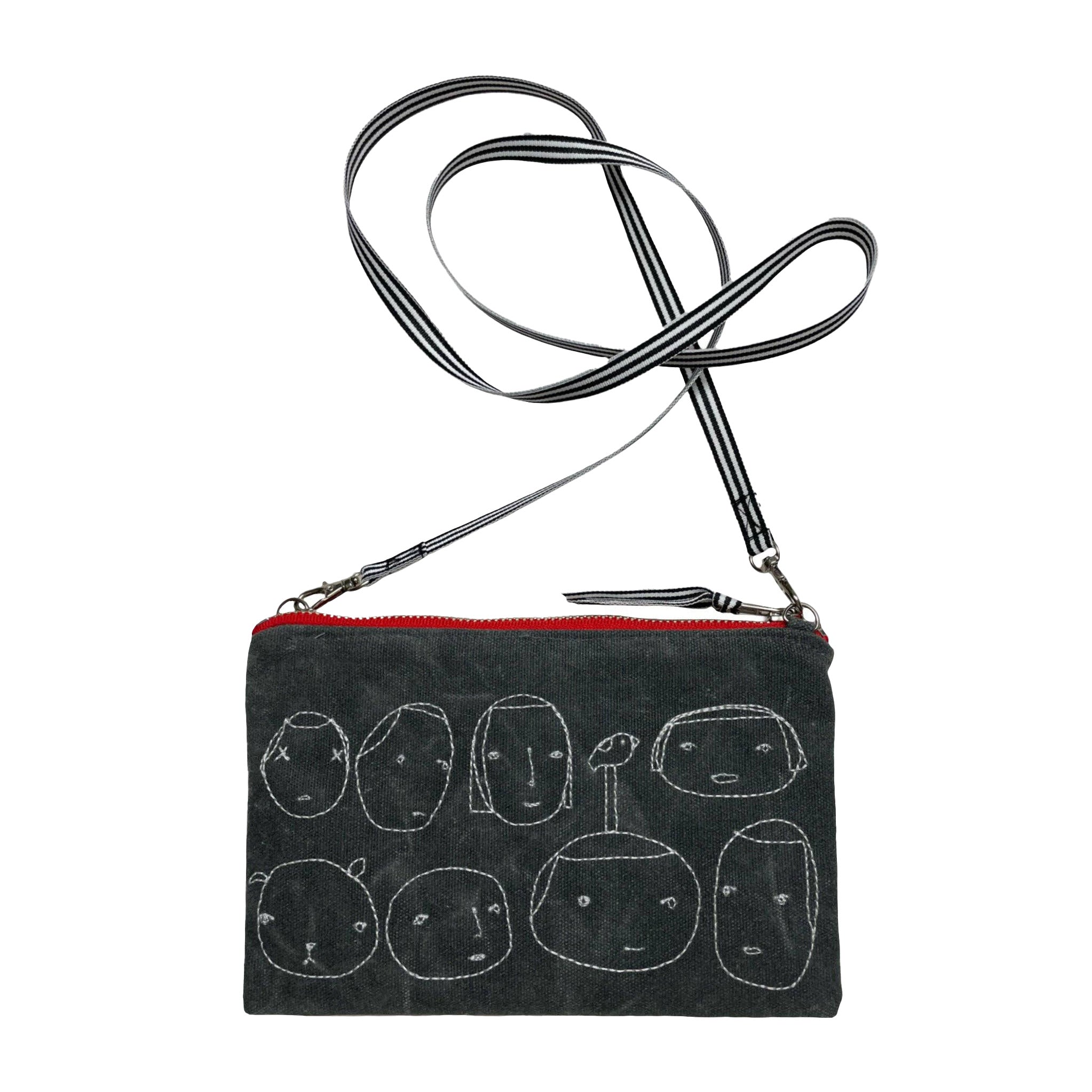 Everyday People Cross Body Bag (small) by K Studio. Designed and handcrafted in Grand Rapids, Michigan. Grey waxed canvas with stitched faces, red zipper, dotted lining, and removable strap to wear crossbody or carry as a clutch.