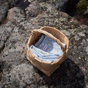 Sauna Towel by Kauniste in reversible cotton-linen jacquard fabric featuring a Finnish lakeside sauna and forest pattern designed by Riikka Laakso.