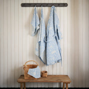 Sauna Robe by Kauniste in reversible cotton-linen jacquard with Riikka Laakso’s Finnish sauna, lake, and forest pattern.