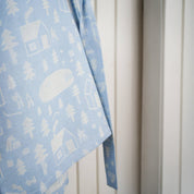Sauna Robe by Kauniste in reversible cotton-linen jacquard with Riikka Laakso’s Finnish sauna, lake, and forest pattern.