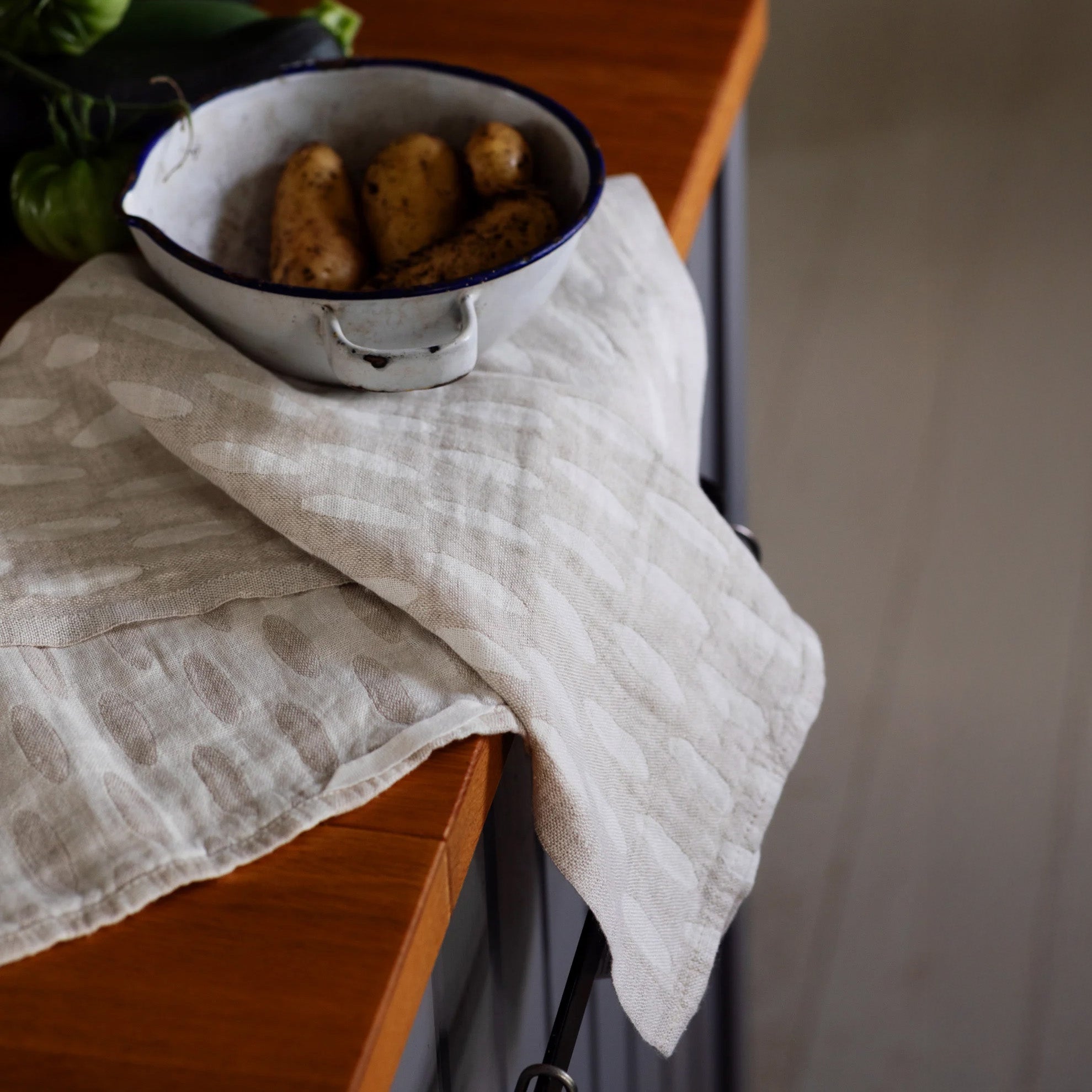 Lapuan Kankurit Helmi Linen Towel in dot pattern. Eco-friendly 100% linen, absorbent, quick-drying, and versatile for kitchen or bath.