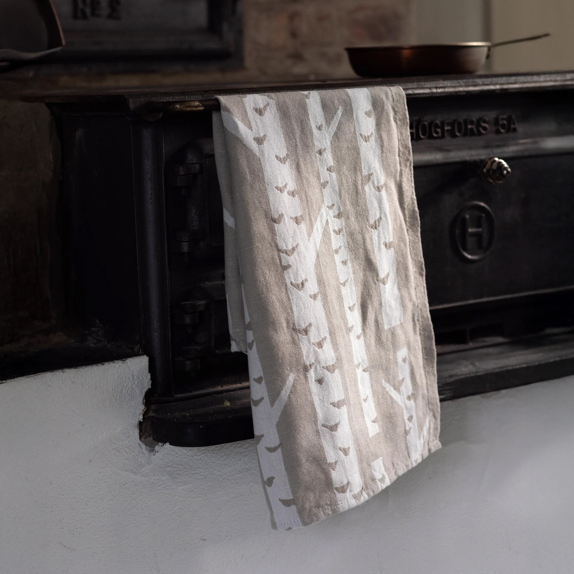 Lapuan Kankurit Koivu Linen Towel featuring a Finnish birch tree pattern in a cotton-linen blend, absorbent, durable, and made in Finland.