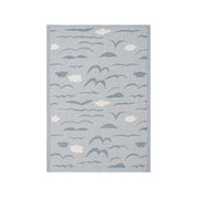 Lapuan Kankurit Rannalla linen kitchen towel featuring blue seabirds and cloud motifs by Armi Teva on soft white washed linen with a hanging loop.