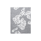 Lapuan Kankurit Saimaannorppa extra-large linen towel designed by Kaarina Tiainen in a white and grey seal pattern, woven in Finland from 100% washed linen.
