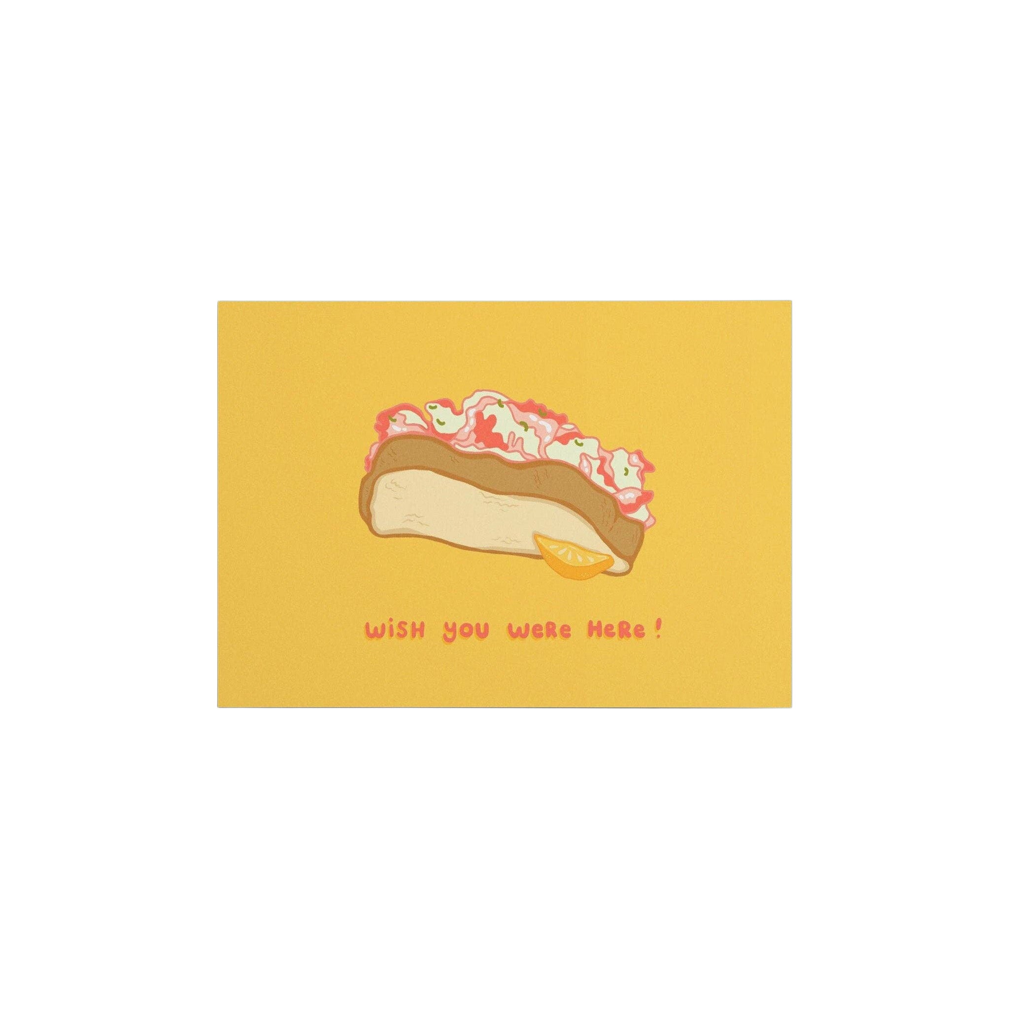 Little Something Co. Lobster Roll Postcard featuring an illustrated Maine lobster roll with lemon wedge and “Wish You Were Here!” on a yellow background.