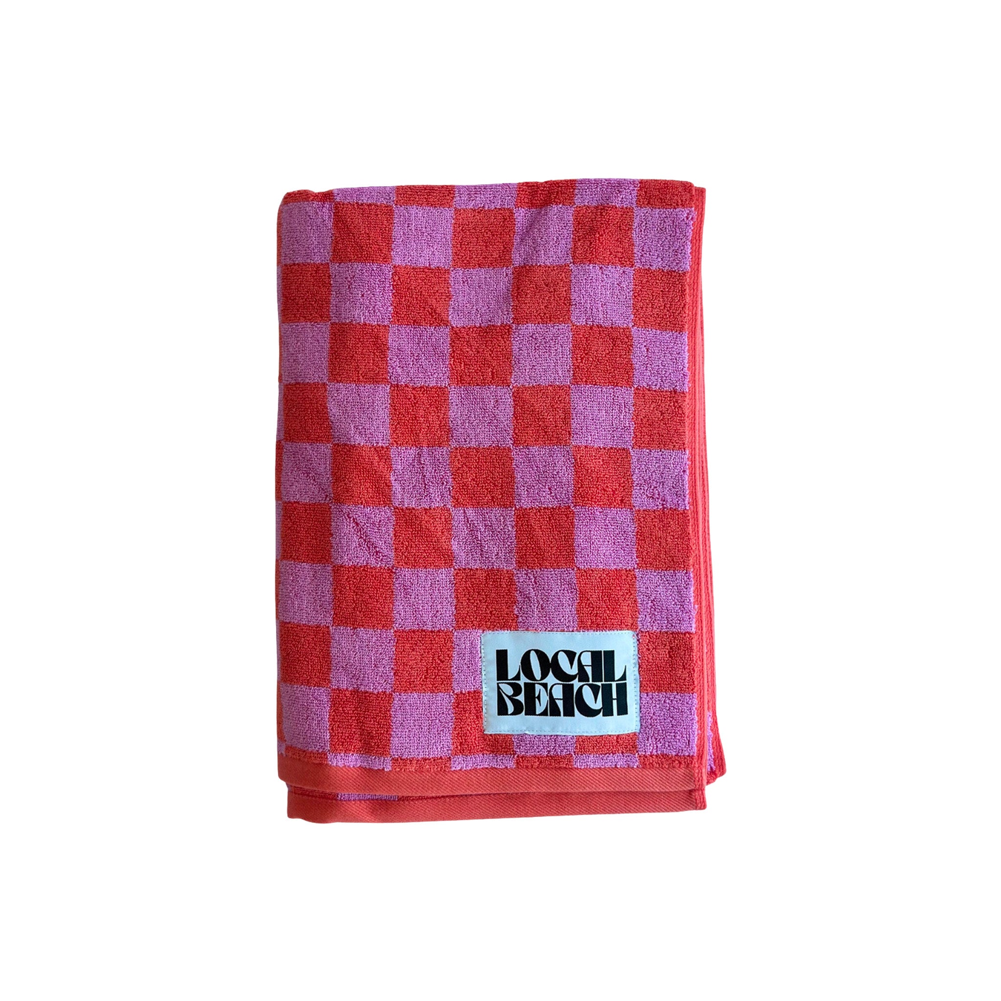 Local Beach Checker Beach Towels in coral/lavender checkerboard pattern. Made from heavyweight 100% cotton jacquard terry for soft, absorbent comfort at the beach, lake, pool, or bath.