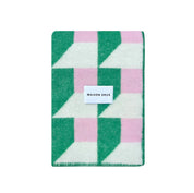 Maison Deux Cubics Blanket in grass and pink, reversible wool throw with cubic pattern and fringed edges, oversized for cozy lounging.